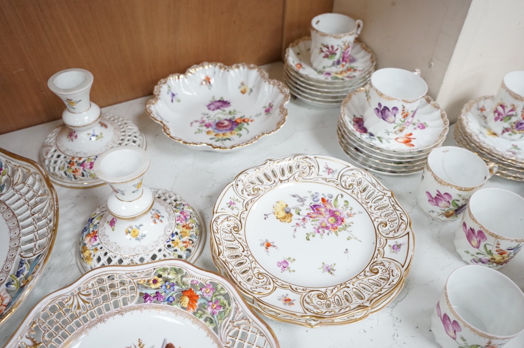 A Dresden porcelain part tea set together with reticulated side plates, largest 26cm in diameter